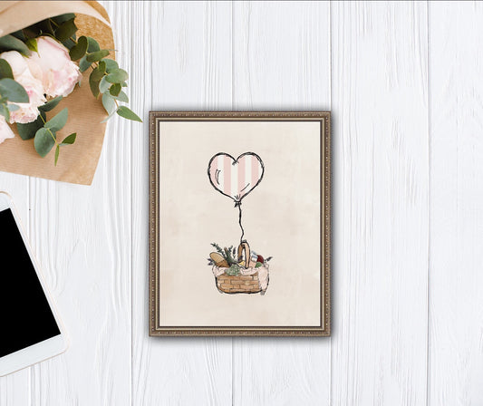 A pink and white heart balloon carries a picnic basket full of bread and wine and fruit and cheese and juice. It's a cute depiction of sending love